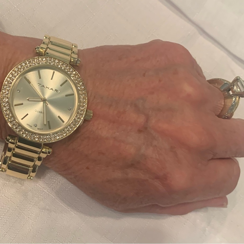 GOLDTONE WATCH WITH PAVE CRYSTAL CZ AROUND THE DIAL. NEW IN BOX
